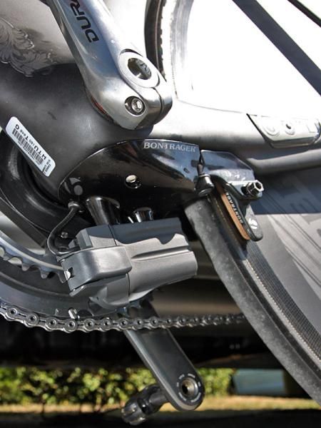 The rear brake is neatly tucked away underneath the bottom bracket. Battery placement could maybe be improved a bit, though, in terms of aerodynamics. If nothing else, this whole area creates some headaches for the team mechanics who have to remove all of this stuff in order to mount the bike on a repair stand.