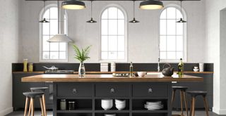 Monohrome kitchen With black island unit and small black ceiling pendants to show a kitchen trend to avoid in 2023