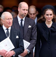 King Charles, Prince William and Princess Kate standing in a row wearing black outfits at the Duchess of Kent's funeral