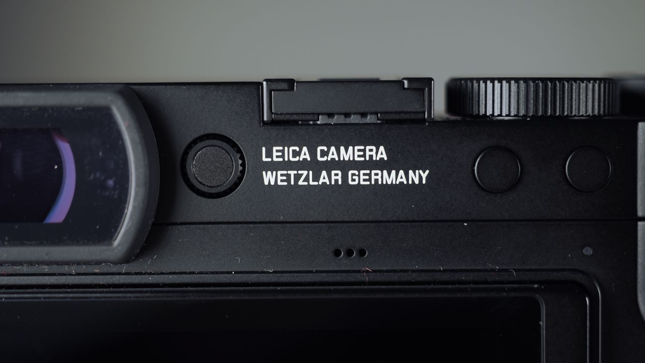 Leica Q3 Monochrom on a wooden surface