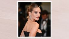 Rosie Huntington-Whiteley is pictured wearing a black dress whilst attending the "The Substance" Red Carpet at the 77th annual Cannes Film Festival at Palais des Festivals on May 19, 2024 in Cannes, France/ in a light, muted pink template