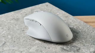 A white wireless Microsoft Surface Precision mouse