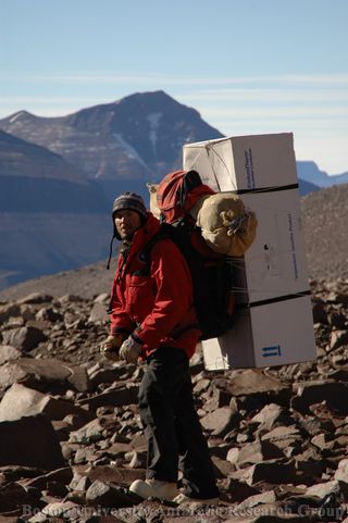 Graduate student Sean Mackay carrying necessary field equipment during a previous expedition. Any gear that needs to be moved around in the field must be carried by team members.