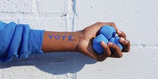 The Word Vote Written on an Arm