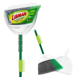 A green and white angled broom with grey and green bristles and a white dustpan