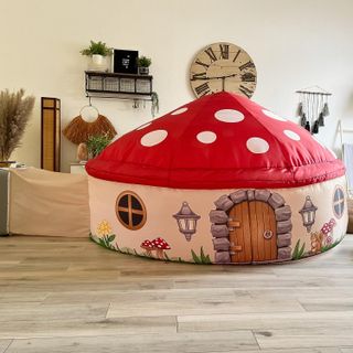 An inflatable mushroom cottage fort