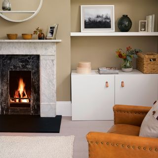 cosy living room with fireplace and shelving