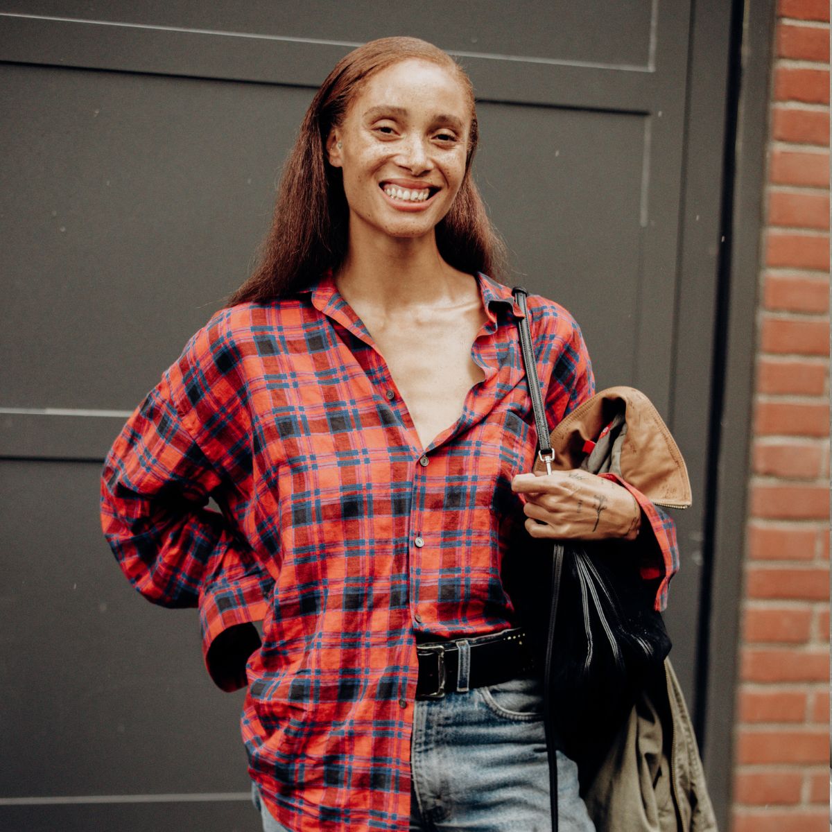 An image of Adwoa Aboah wearing the flannel shirt trend.