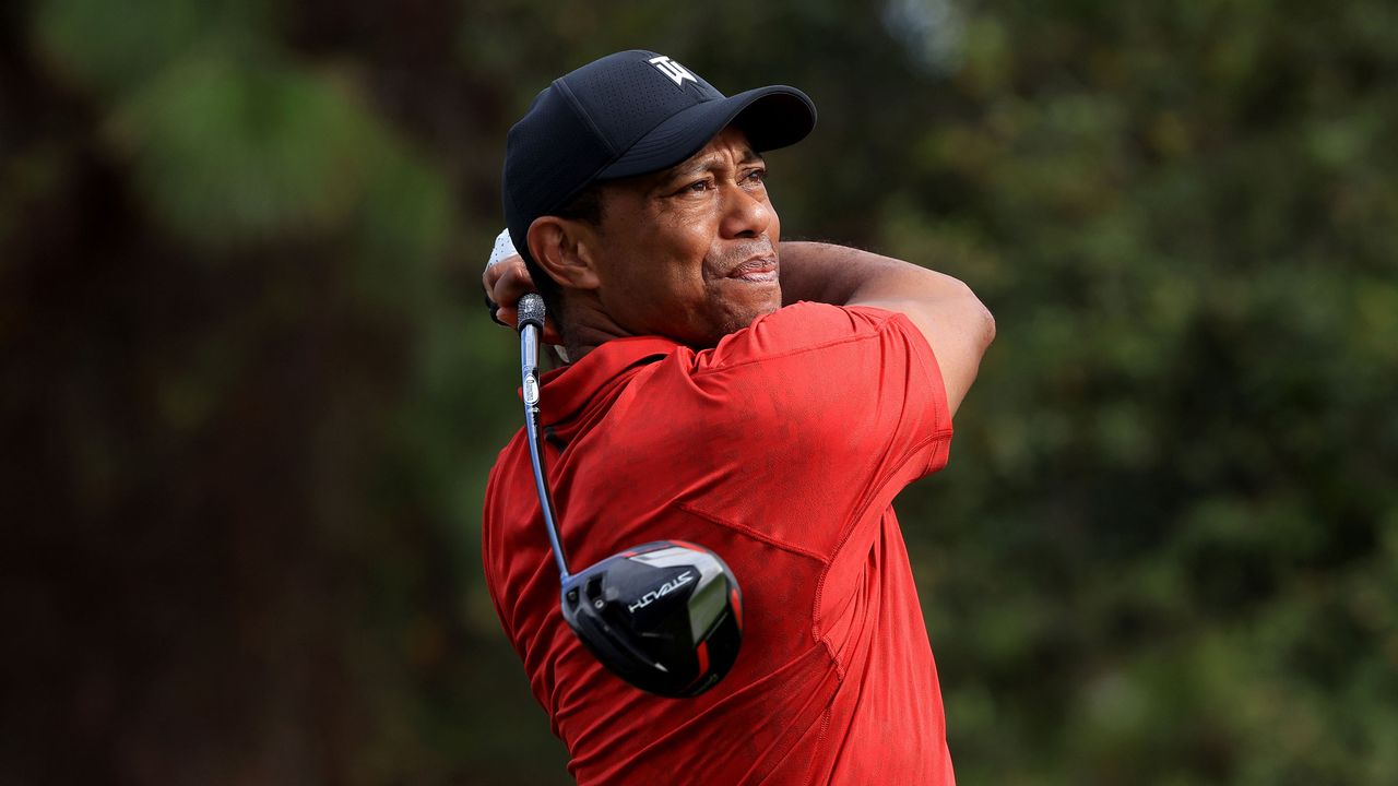 Tiger Woods holds his finish on a shot