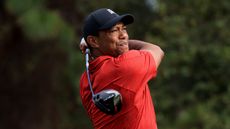 Tiger Woods holds his finish on a shot