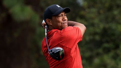 Tiger Woods holds his finish on a shot
