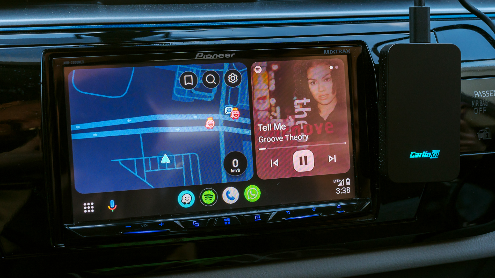 Carlinkit 5.0 (2air) adapter next to Android Auto on infotainment screen.