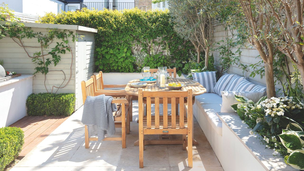 Wooden garden furniture, table and chairs, on patio area