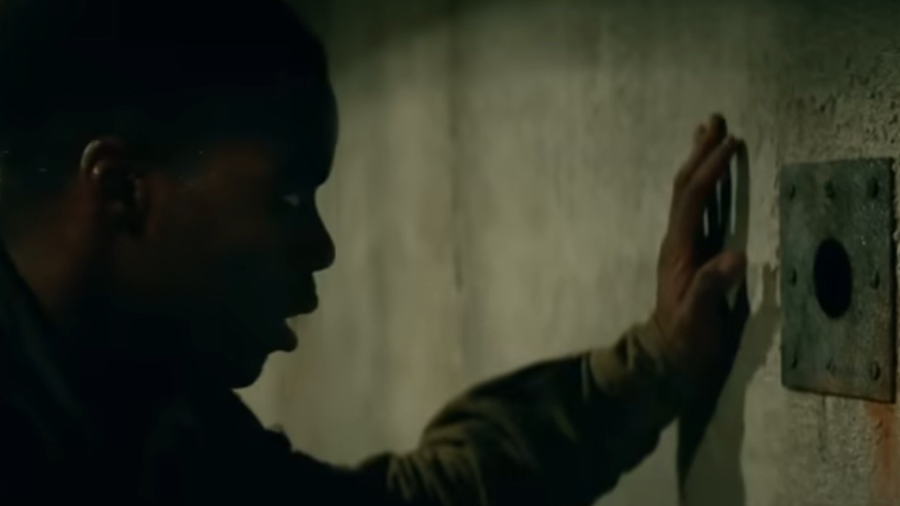 Jovan Adepo staring into a hole in Overlord