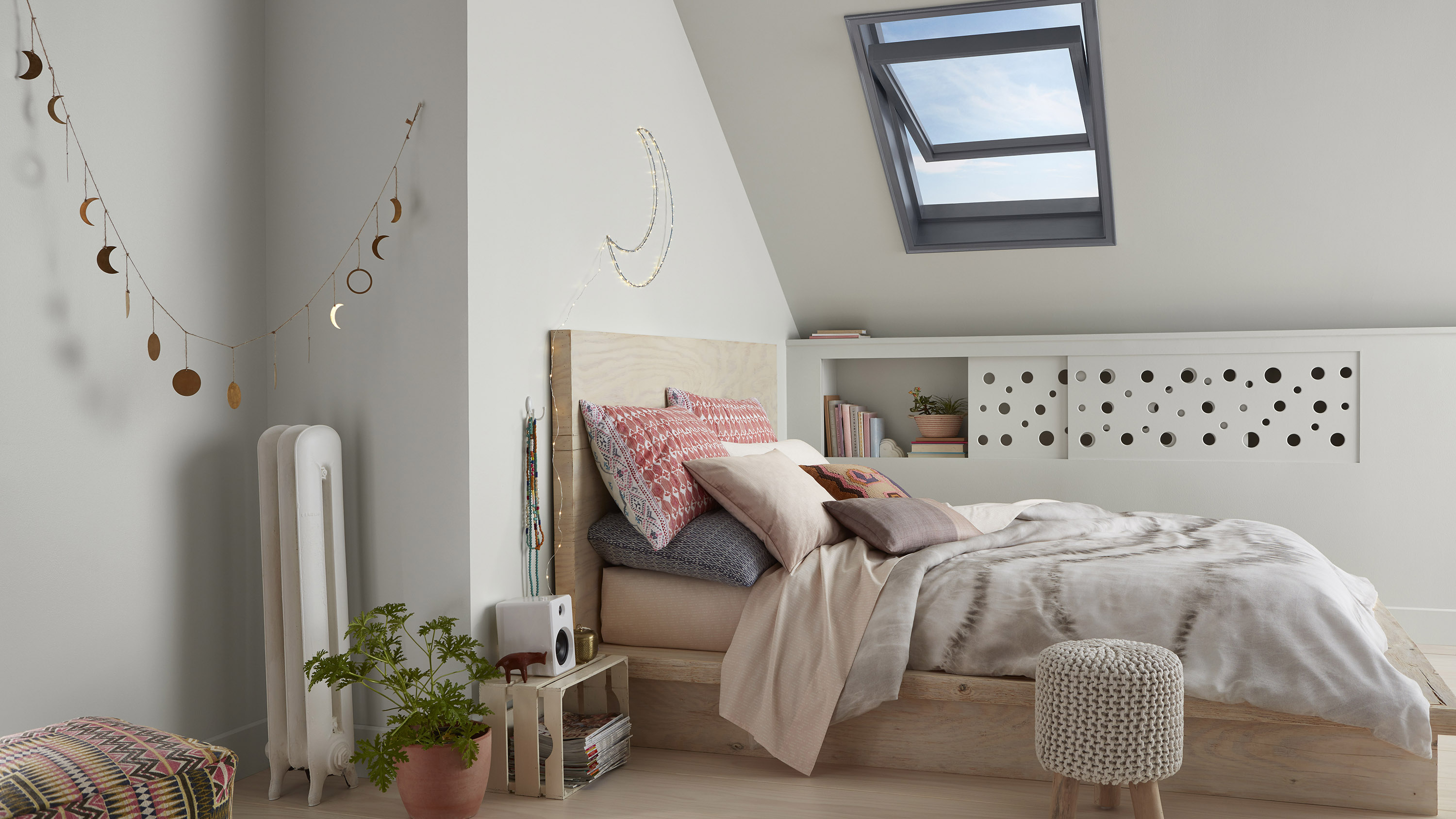 Loft bedroom with eaves shelving