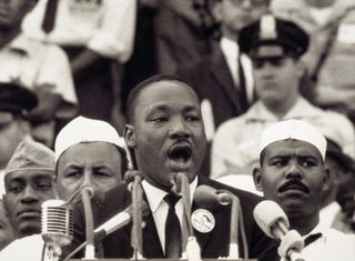 Martin Luther King Jr., gives his "I Have a Dream" speech to a crowd before the Lincoln Memorial during the Freedom March in Washington, DC, on August 28, 1963