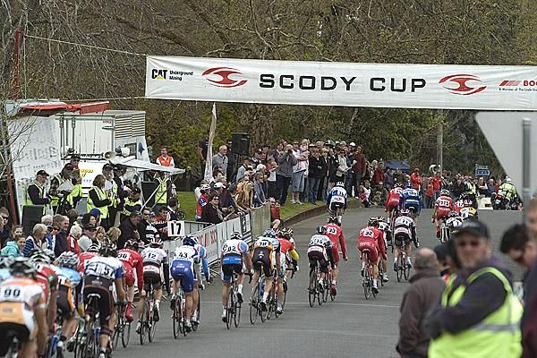The field head under the banner and up the small rise in Westbury in the second-half of the 52 kilometre criterium.