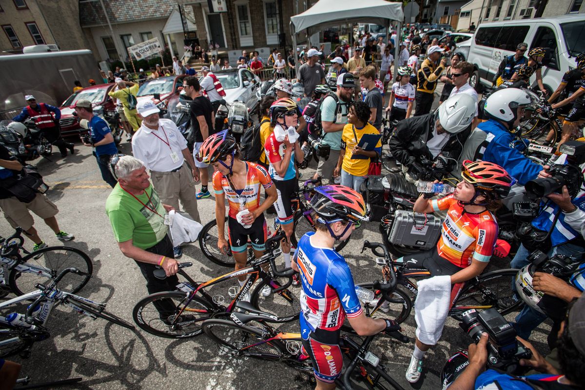A big crowd around riders after the finish