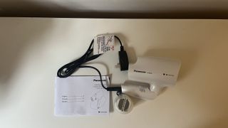 Panasonic nanoe Travel Hair Dryer (EH-NA2C-W) with folded handle and instruction booklet