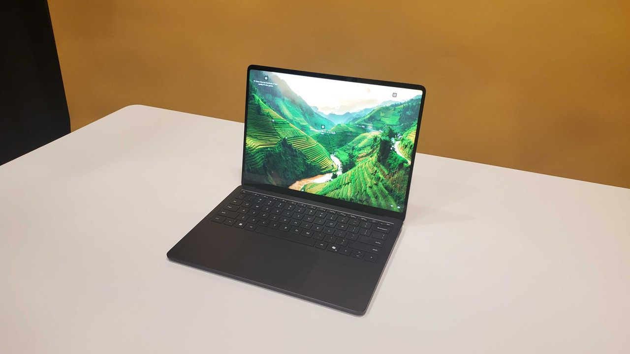 black laptop on white table