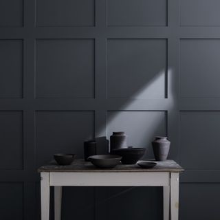 charcoal black wall with table