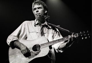 Neil Young performs onstage in the Netherlands