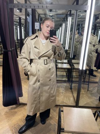 Woman wears & Other Stories trench coat