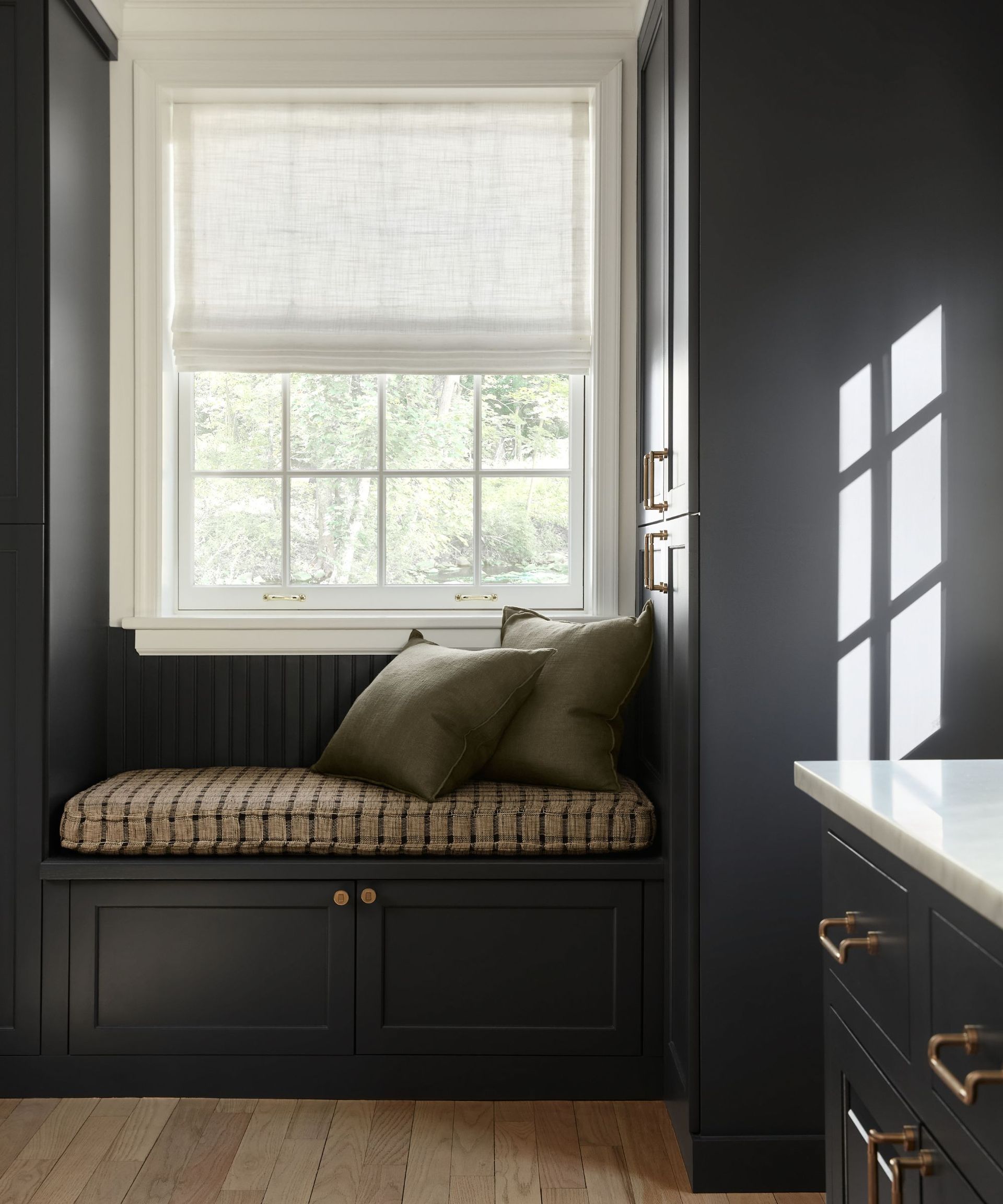 Window seat with two cushions.