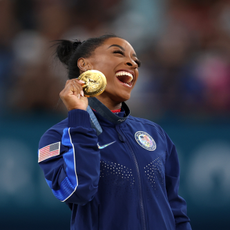 Gold medalist Simone Biles of Team United States celebrates on the podium during the medal ceremony for the Artistic Gymnastics Women's Vault Final on day eight of the Olympic Games Paris 2024 at Bercy Arena on August 03, 2024 in Paris, France