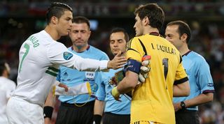 Portugal captain Cristiano Ronaldo greets Spain skipper Iker Casillas ahead of their teams' semi-final clash at Euro 2012.