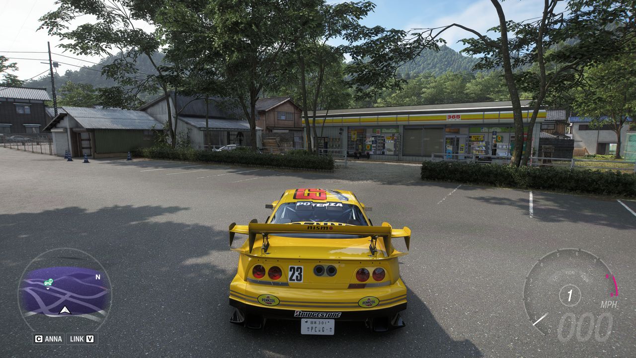 Forza Horizon 6 Treasure Cars: A player parked with their bright yellow car outside a shop in a town.