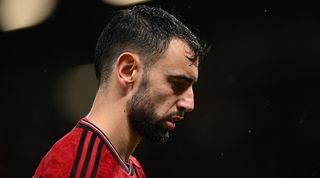Bruno Fernandes looks dejected during Manchester United's 3-0 loss to Bournemouth in December 2023.