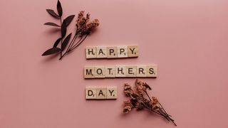 Mother's Day in wooden block letters and dried flowers