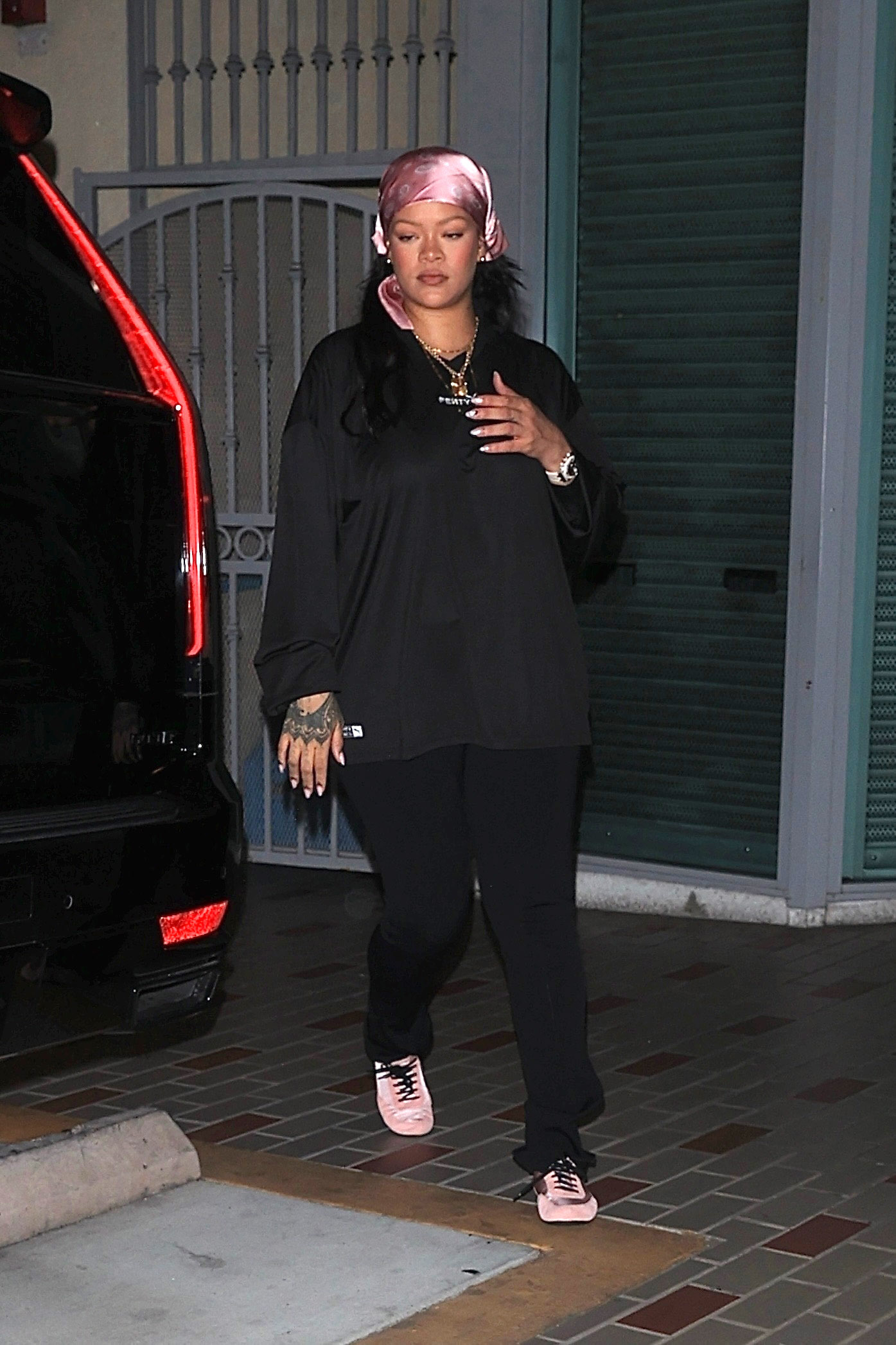Rihanna wore satin pink sneakerinas from Prada for her first outing post-giving birth to a baby girl