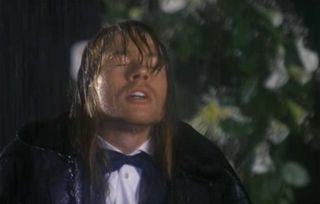 A still from the November Rain video showing Axl Rose soaked to the skin