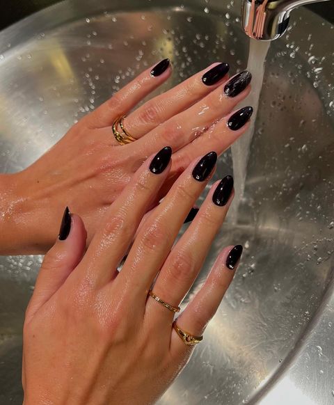 A manicure by @iramshelton with OPI Lincoln Park After Dark nail polish