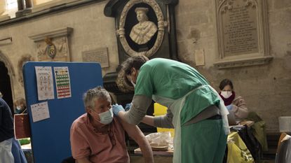 A patient receives his Covid-19 jab at a vaccination centre in Salisbury Cathedral