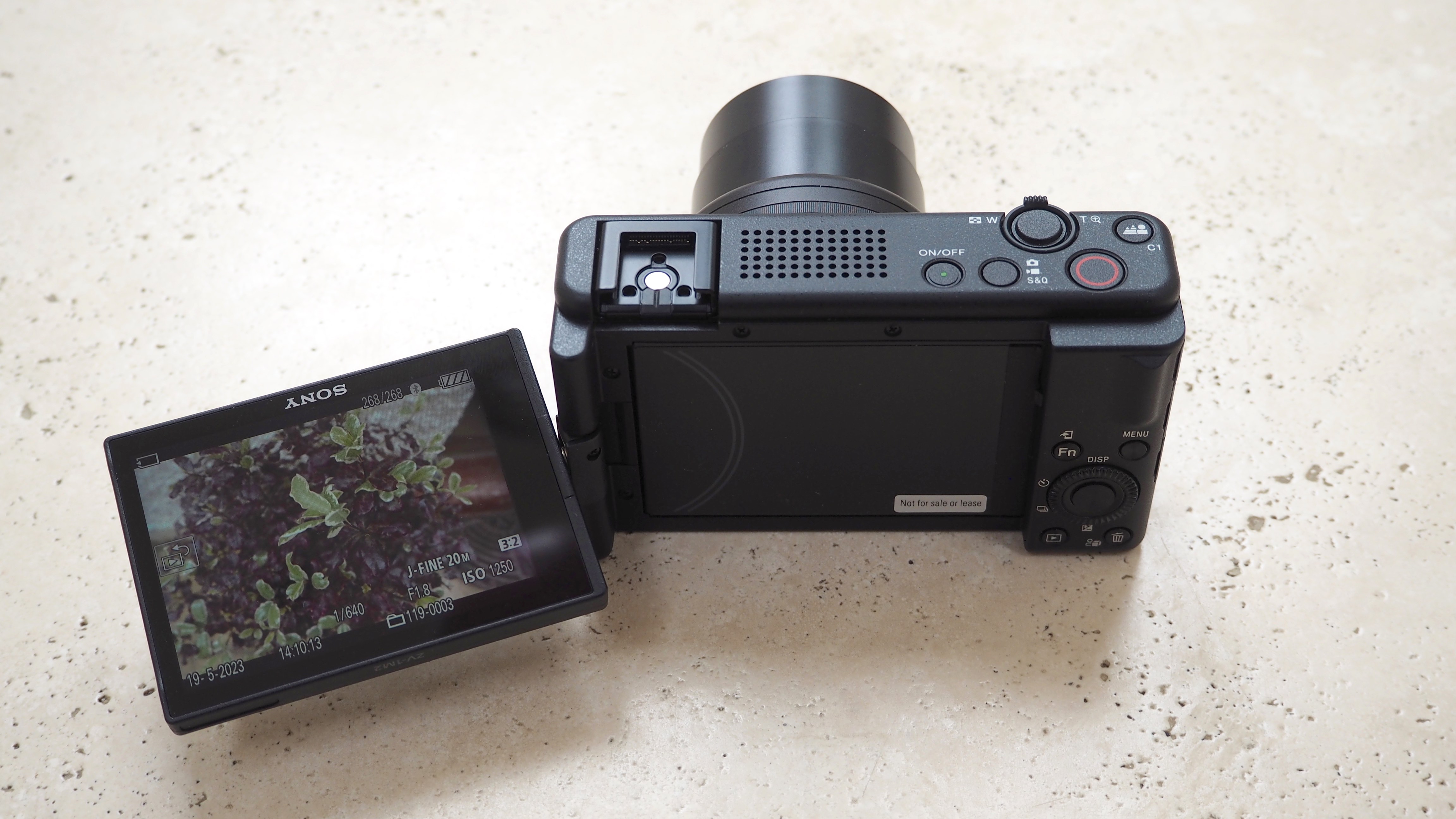 Sony ZV-1 II camera on marble table with screen flipped out