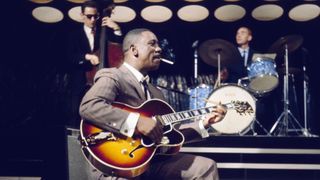 American jazz guitarist Wes Montgomery (1923-1968) performs with a Gibson L-5 semi acoustic guitar in a television studio during a recording for the television series 'Tempo' in 1965