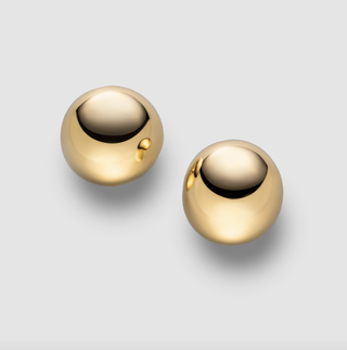 a pair of ball earrings worn by Jennifer Lopez