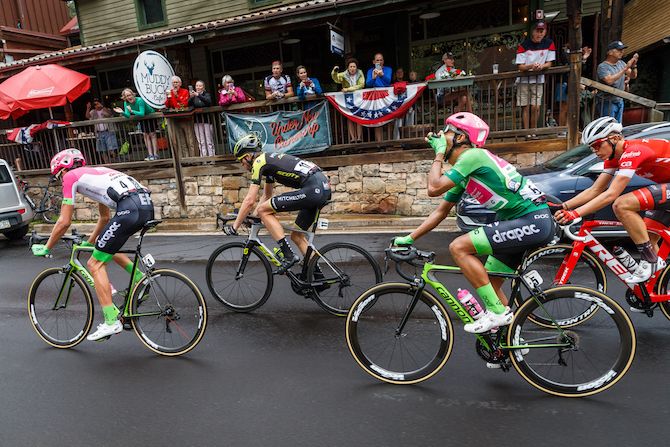 The break gets cheered on through a small town along the route of stage 3 of the 2018 Colorado Classic