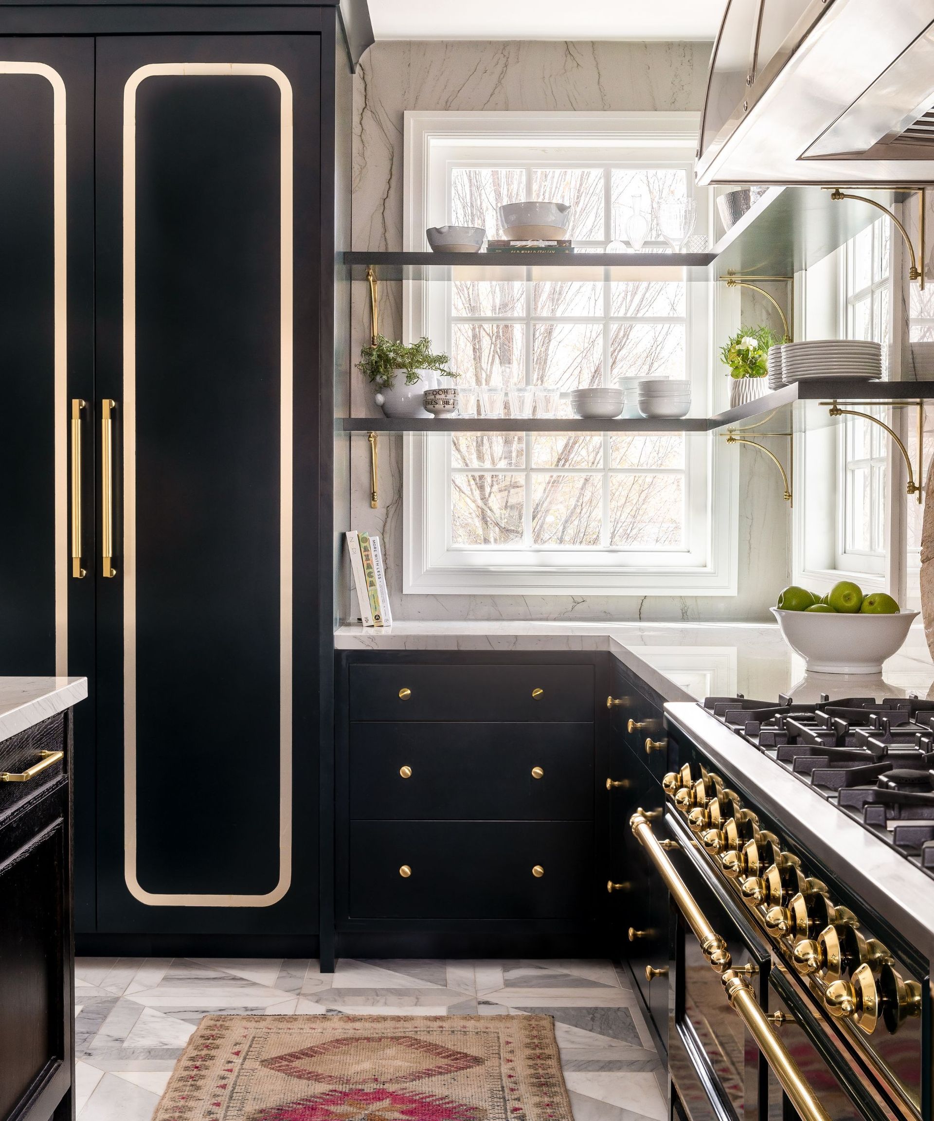dark green and gold kitchen cabinets with shelves across window