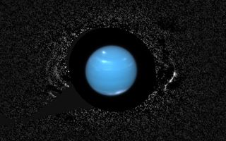 Neptune's slender rings are seen with remarkable clarity in this composite image taken by the Hubble Space Telescope. Image released Oct. 8, 2013.