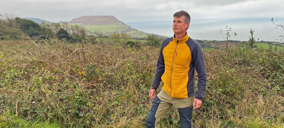 Hiker wearing Smartwool Smartloft Jacket