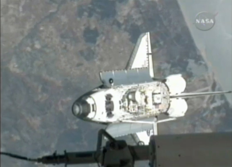 Shuttle Atlantis Docks at Space Station