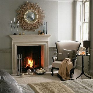 bedroom fireplace and armchair with cushion