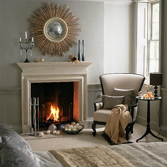 bedroom fireplace and armchair with cushion