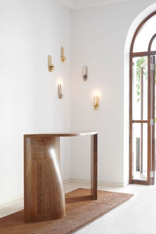 Sculptural console and wall lights in Æquō design gallery, Mumbai