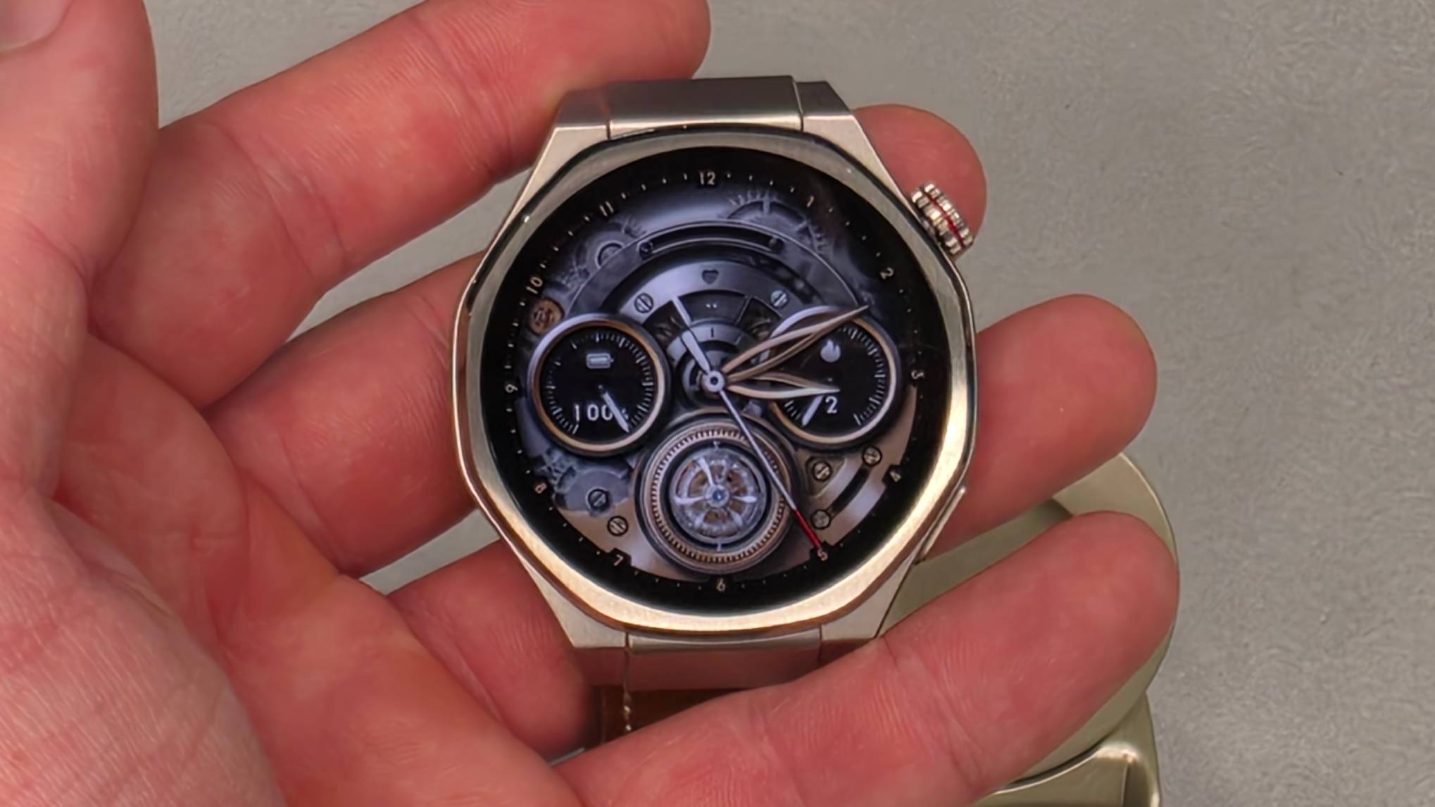 The Honor Watch 5 Ultra in a man's hand. 
