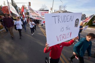 Freedom Convoy protestors marching in Ottawa
